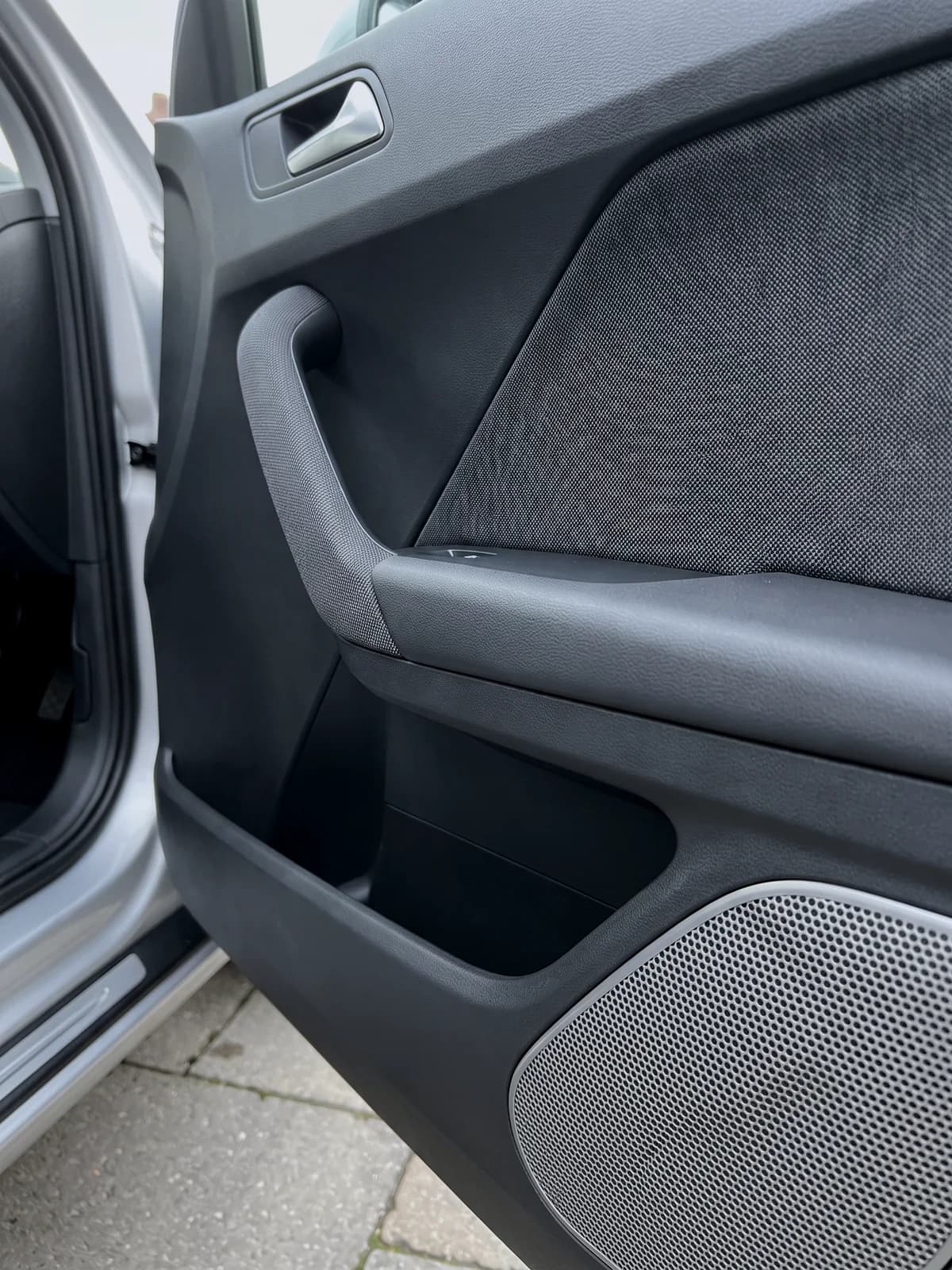 Clean door panel, armrest and speaker grille