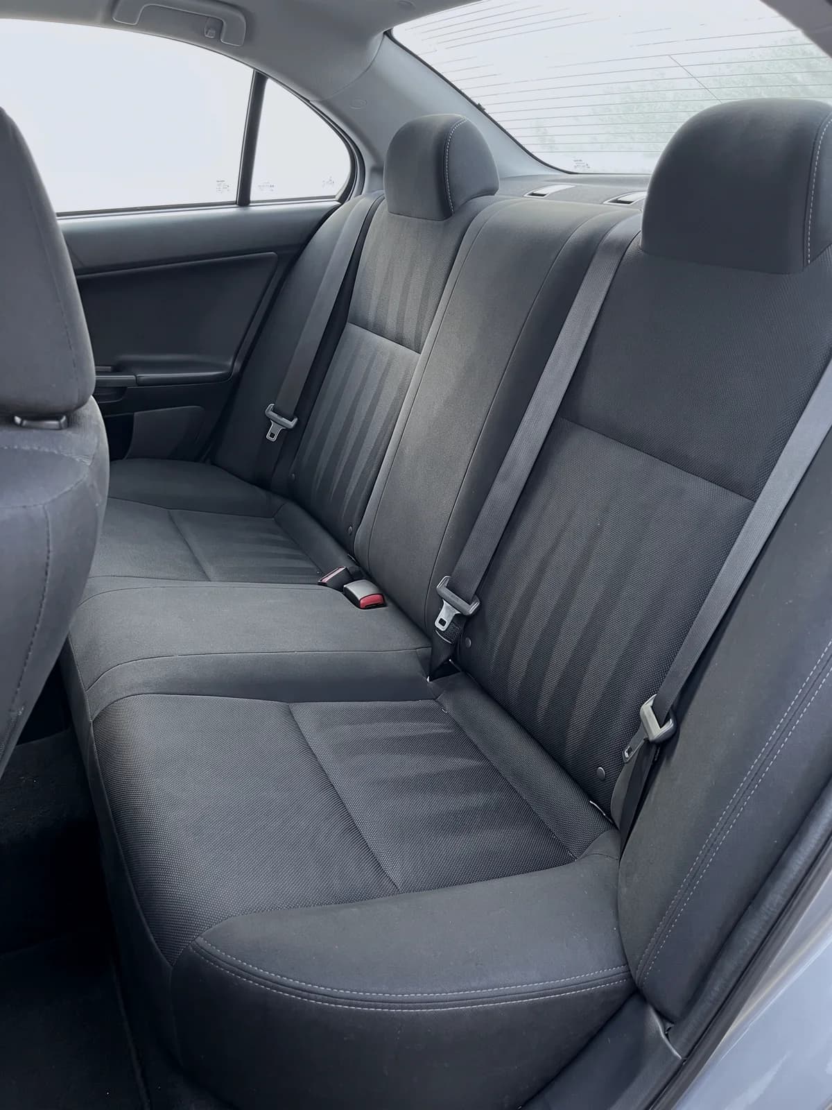 Rear bench seat vacuumed, with clean lines across the upholstery