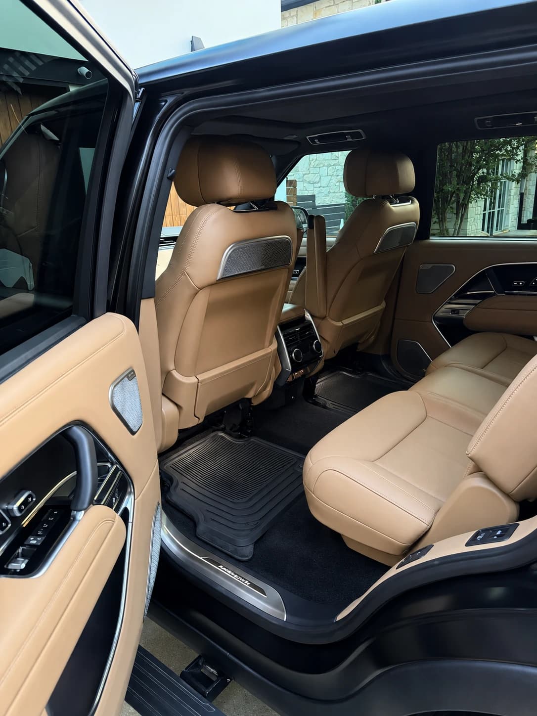 Tan luxury SUV rear cabin after interior detailing