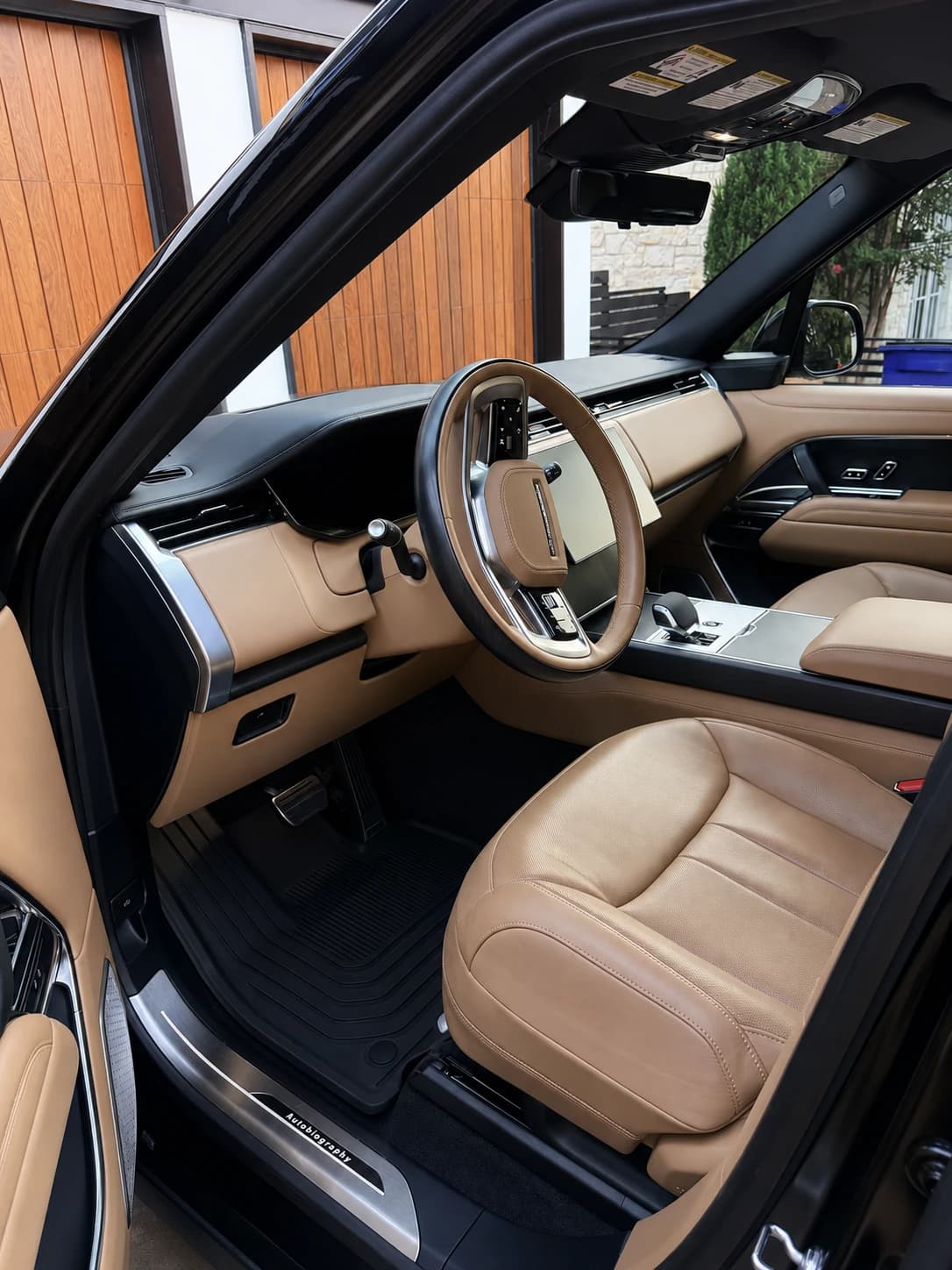 Tan luxury SUV driver area after interior detailing